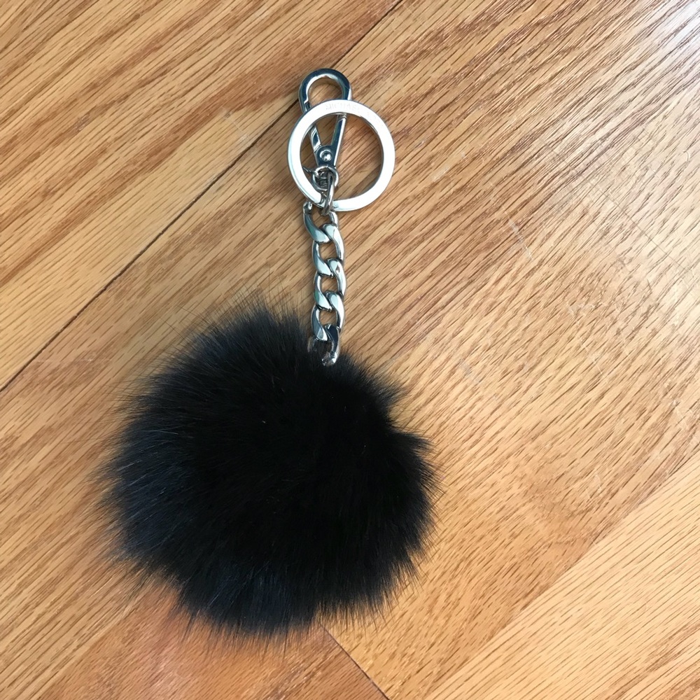 Micheal Kors fuzzy black Pom Pom
